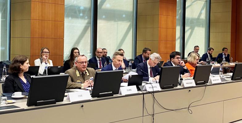 A group of dignitaries at a high-level conference. 